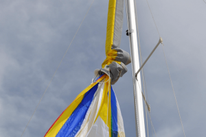 yellow white and blue spinnaker with sock sleeve