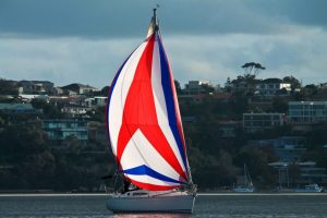 tri color asymmetrical spinnaker on Jeanneau