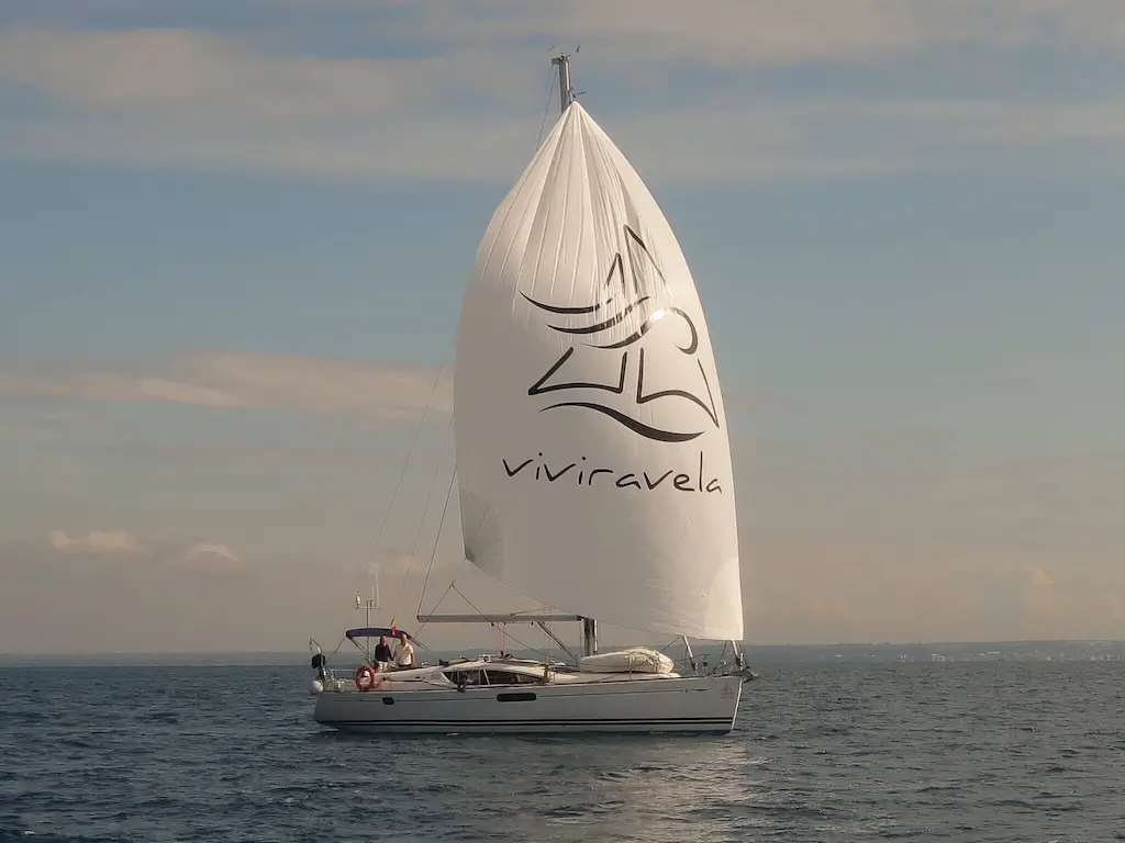 Jeanneau Sun Odyssey 45 DS with company logo on asymmetric spinnaker by isails
